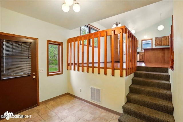 19254 Adak Cir, Eagle River, AK 99577 - stairs with a chandelier, baseboards, and tile patterned floors