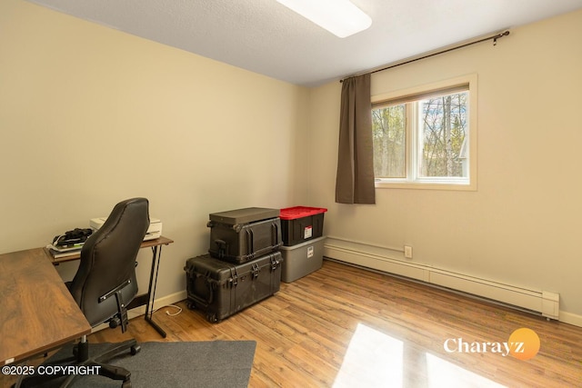 1147 Choctaw Rd, North Pole, AK 99705 - office area with a baseboard radiator, wood finished floors, and baseboards