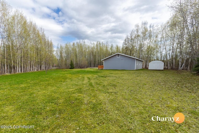 1147 Choctaw Rd, North Pole, AK 99705 - view of grassy yard featuring an outbuilding