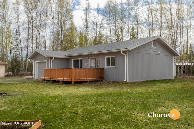 1147 Choctaw Rd, North Pole, AK 99705 - rear view of property featuring a lawn, a wooden deck, roof with shingles, and an attached garage