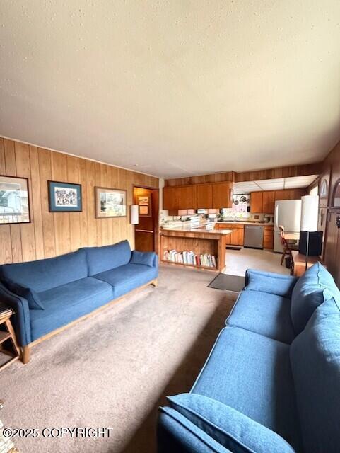 1411 Mission Rd, Kodiak, AK 99615 - living area with light colored carpet and wooden walls