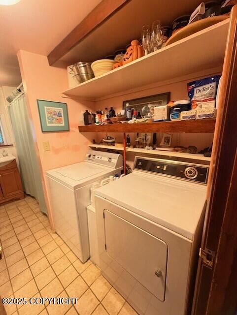 1411 Mission Rd, Kodiak, AK 99615 - laundry area with light tile patterned floors and washer and dryer