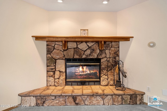 18113 Misty Falls Cir, Eagle River, AK 99577 - detailed view of carpet floors, a stone fireplace, and baseboards