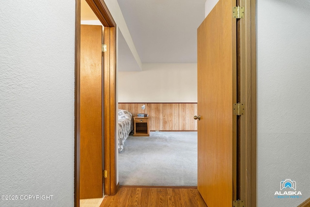 18113 Misty Falls Cir, Eagle River, AK 99577 - hallway with a textured wall and wood finished floors