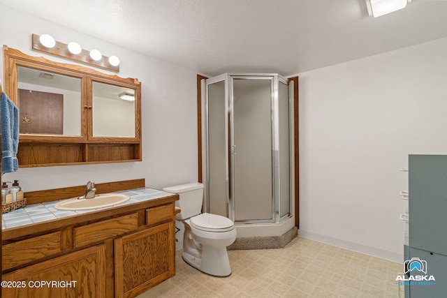 18113 Misty Falls Cir, Eagle River, AK 99577 - bathroom featuring a stall shower, toilet, and vanity