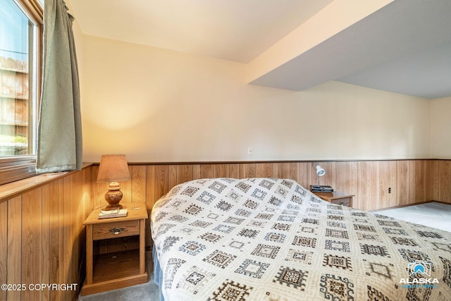 18113 Misty Falls Cir, Eagle River, AK 99577 - bedroom with wooden walls, wainscoting, and multiple windows