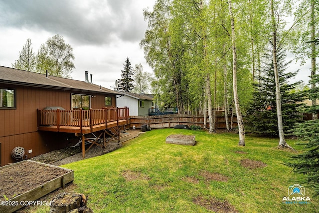 18113 Misty Falls Cir, Eagle River, AK 99577 - view of yard with a wooden deck and a vegetable garden