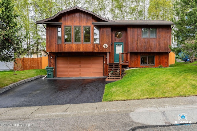 18113 Misty Falls Cir, Eagle River, AK 99577 - bi-level home featuring driveway and an attached garage