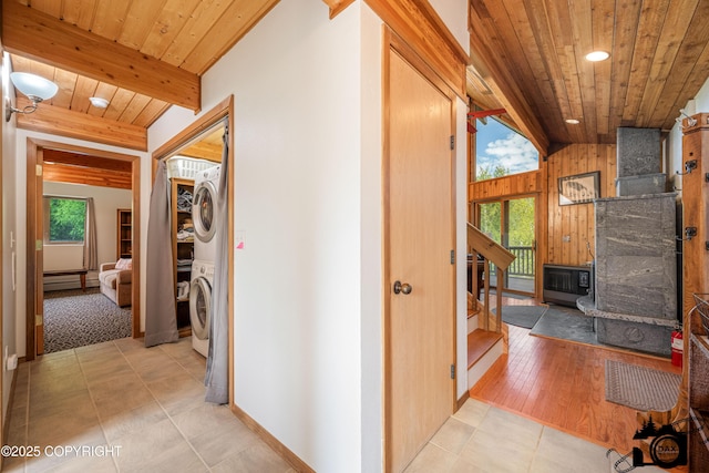 18365 E Twin Hills Ln, Sutton, AK 99645 - hall with stacked washer / drying machine, wooden ceiling with exposed beams, a baseboard radiator, light tile patterned floors, and recessed lighting