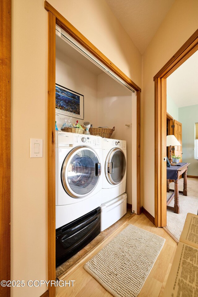 41293 Crested Crane St, Homer, AK 99603 - laundry area with separate washer and dryer and light wood-style floors