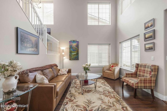 2823 Discovery Bay Dr, Anchorage, AK 99515 - living area featuring wood finished floors, a towering ceiling, and baseboards