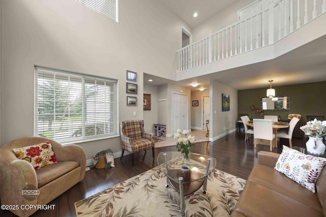 2823 Discovery Bay Dr, Anchorage, AK 99515 - living area featuring wood finished floors, baseboards, a towering ceiling, and recessed lighting