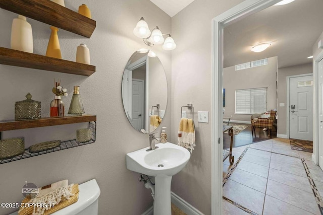 2823 Discovery Bay Dr, Anchorage, AK 99515 - bathroom featuring toilet, tile patterned floors, and baseboards