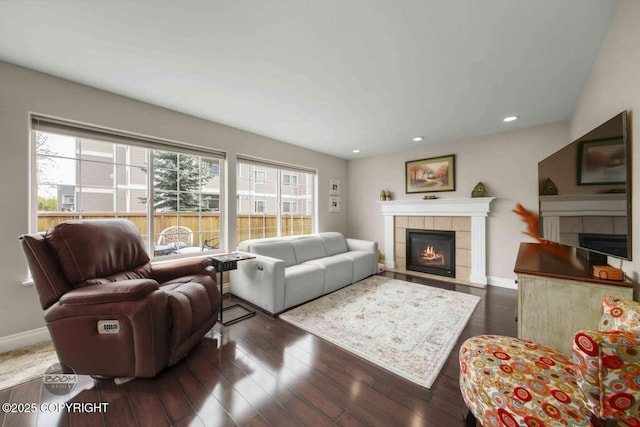 2823 Discovery Bay Dr, Anchorage, AK 99515 - living area with a tiled fireplace, baseboards, hardwood / wood-style flooring, and recessed lighting