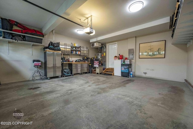 2823 Discovery Bay Dr, Anchorage, AK 99515 - garage featuring a garage door opener, electric panel, and a workshop area