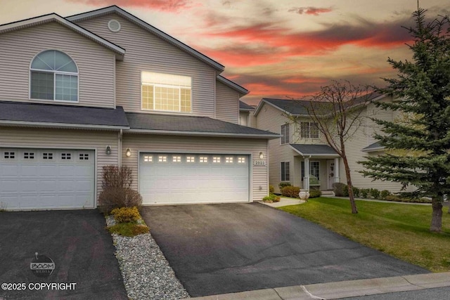 2823 Discovery Bay Dr, Anchorage, AK 99515 - view of front of property with driveway, an attached garage, and a front yard