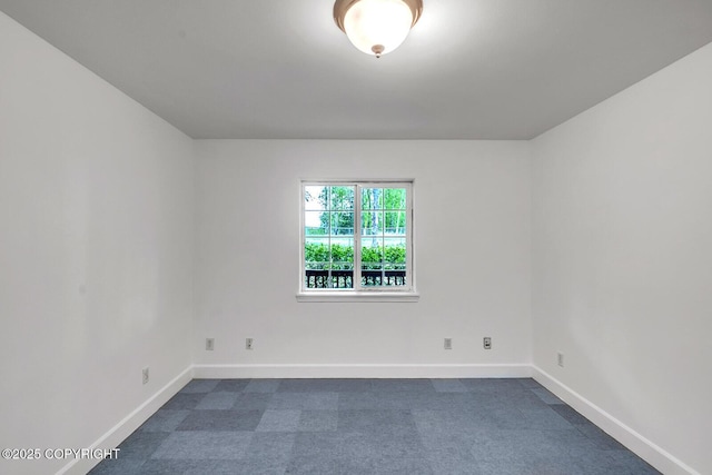 1151 W Gail Dr, Wasilla, AK 99654 - empty room with baseboards and dark carpet
