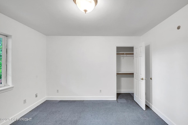 1151 W Gail Dr, Wasilla, AK 99654 - unfurnished bedroom with carpet flooring, baseboards, and a closet