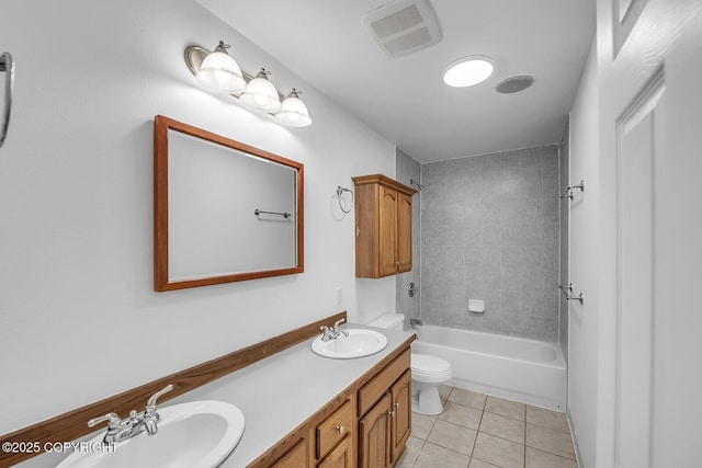 1151 W Gail Dr, Wasilla, AK 99654 - bathroom featuring tile patterned floors, toilet, double vanity, and bathtub / shower combination