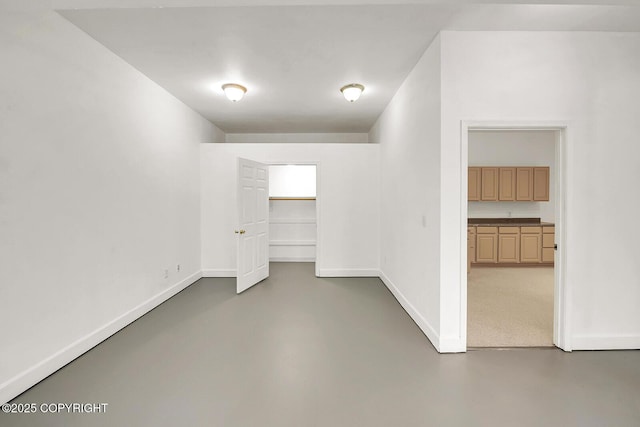 1151 W Gail Dr, Wasilla, AK 99654 - spare room featuring concrete flooring and baseboards