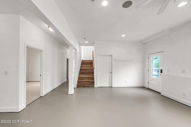 1151 W Gail Dr, Wasilla, AK 99654 - unfurnished living room with recessed lighting, stairway, finished concrete floors, baseboards, and ceiling fan