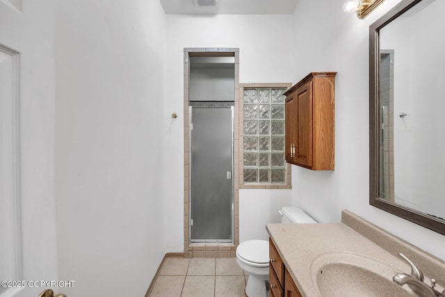 1151 W Gail Dr, Wasilla, AK 99654 - bathroom with toilet, a shower stall, tile patterned floors, and vanity