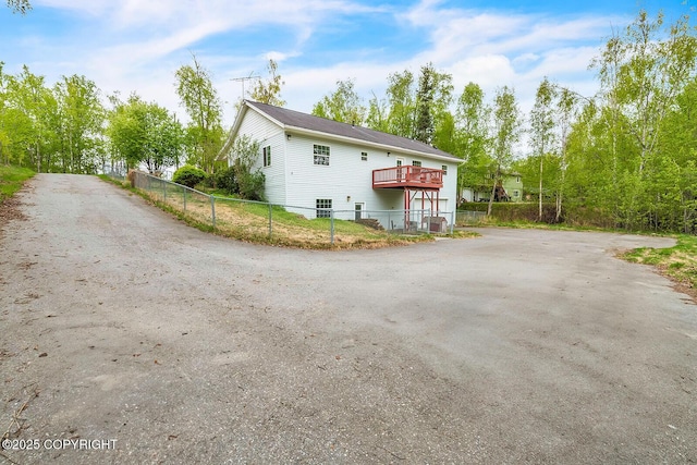 1151 W Gail Dr, Wasilla, AK 99654 - view of side of property with a deck
