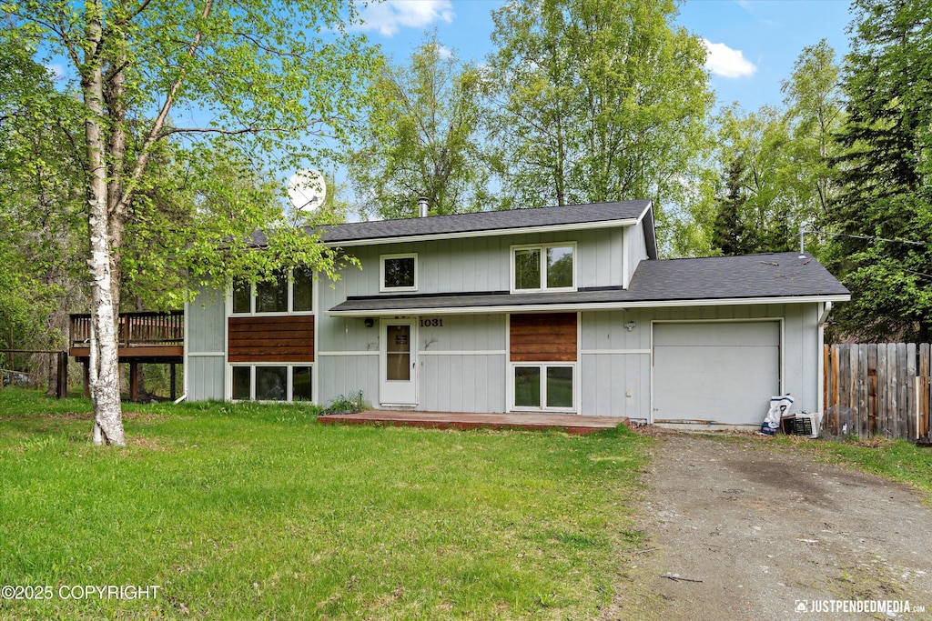1031 E Dunedin St, Wasilla, AK 99654 - view of front of home with asphalt driveway, an attached garage, and roof with shingles