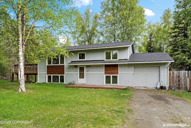1031 E Dunedin St, Wasilla, AK 99654 - view of front of home with asphalt driveway, an attached garage, and roof with shingles
