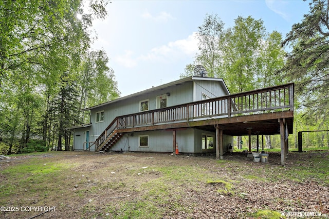 1031 E Dunedin St, Wasilla, AK 99654 - rear view of house featuring stairs and a deck