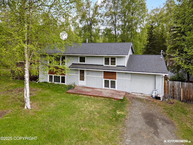 1031 E Dunedin St, Wasilla, AK 99654 - view of front facade with asphalt driveway, a garage, and roof with shingles