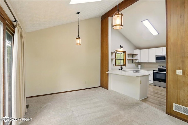 2921 Rocky Bay Cir, Anchorage, AK 99515 - kitchen with stainless steel appliances, a sink, white cabinets, light colored carpet, and open shelves