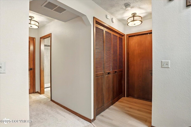 2921 Rocky Bay Cir, Anchorage, AK 99515 - corridor featuring baseboards