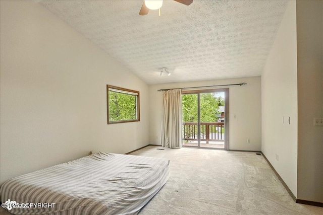 2921 Rocky Bay Cir, Anchorage, AK 99515 - bedroom featuring access to outside, light carpet, baseboards, a textured ceiling, and ceiling fan