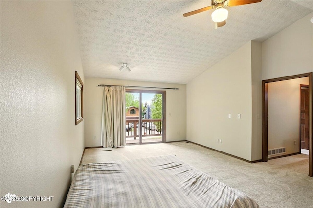 2921 Rocky Bay Cir, Anchorage, AK 99515 - empty room with light carpet, ceiling fan, baseboards, and a textured ceiling