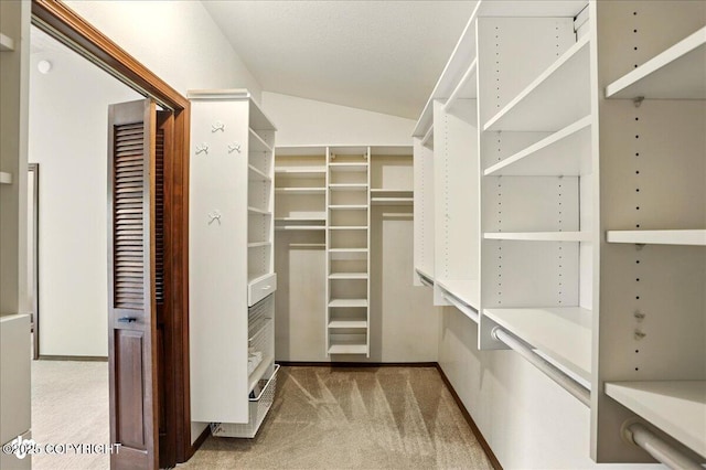 2921 Rocky Bay Cir, Anchorage, AK 99515 - spacious closet featuring carpet and lofted ceiling