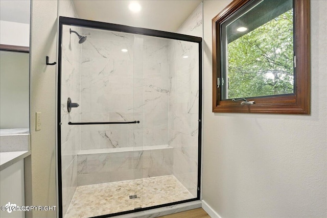 2921 Rocky Bay Cir, Anchorage, AK 99515 - full bathroom with a marble finish shower, vanity, and baseboards