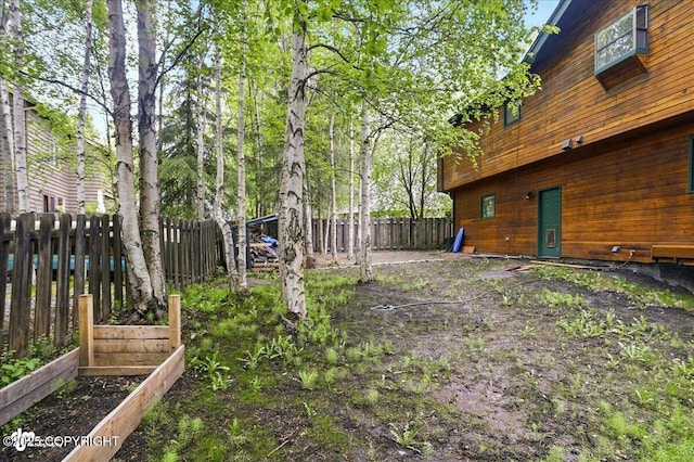 2921 Rocky Bay Cir, Anchorage, AK 99515 - fenced backyard with a garden