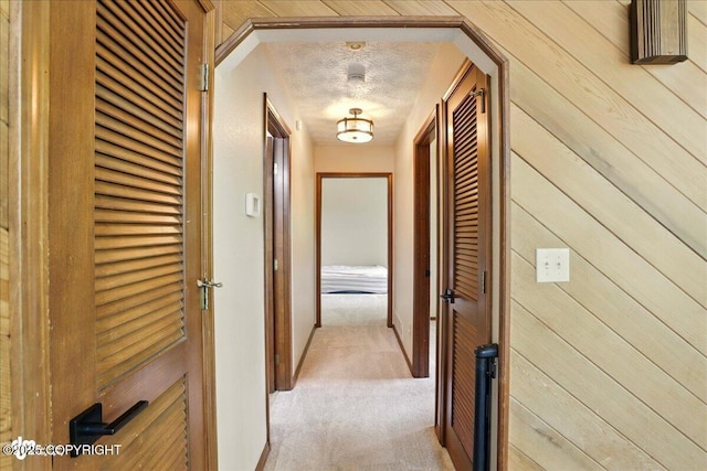 2921 Rocky Bay Cir, Anchorage, AK 99515 - hallway with light colored carpet and a textured ceiling