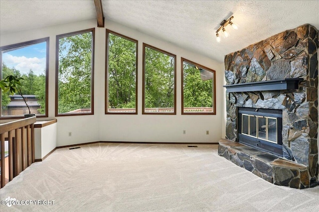 2921 Rocky Bay Cir, Anchorage, AK 99515 - unfurnished living room featuring carpet floors, baseboards, a fireplace, and a textured ceiling