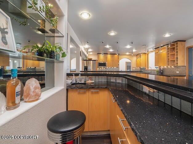 37397 Cetacea Ln, Kenai, AK 99611 - bar area with a sink, recessed lighting, tasteful backsplash, and stainless steel microwave