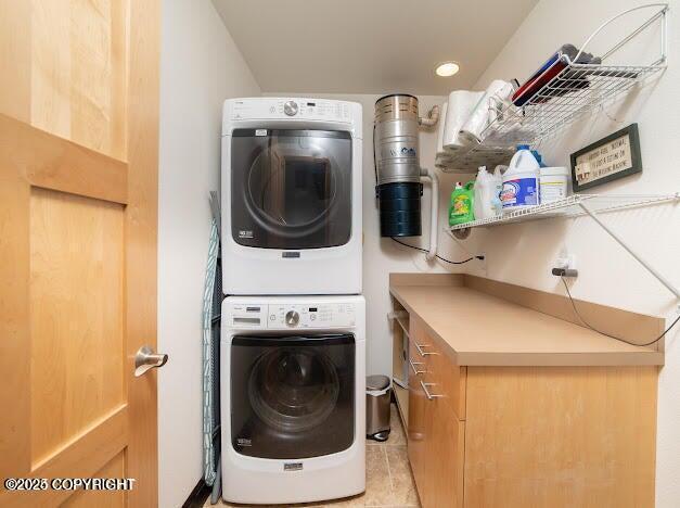37397 Cetacea Ln, Kenai, AK 99611 - laundry area with stacked washer / drying machine, recessed lighting, and light tile patterned floors
