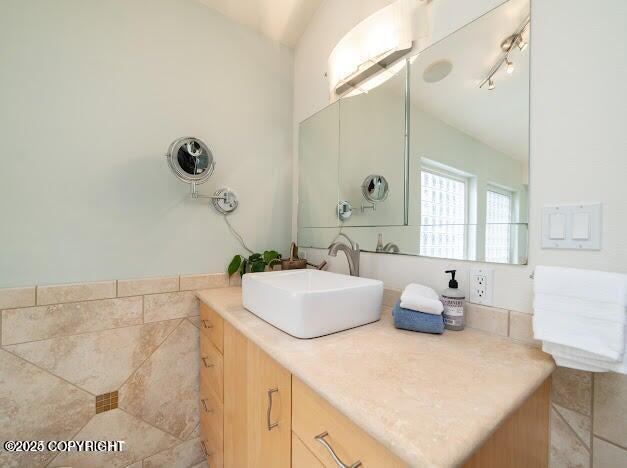 37397 Cetacea Ln, Kenai, AK 99611 - bathroom featuring vanity and lofted ceiling