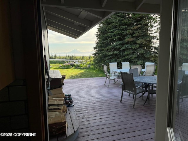 37397 Cetacea Ln, Kenai, AK 99611 - wooden terrace featuring outdoor dining area and a lawn