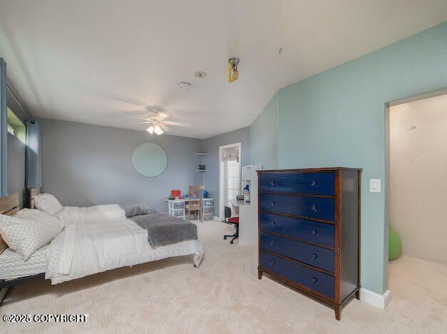 37397 Cetacea Ln, Kenai, AK 99611 - bedroom featuring light carpet and a ceiling fan