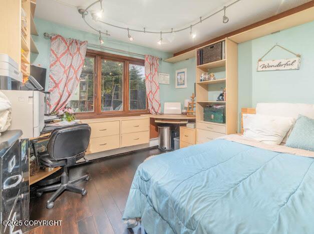 37397 Cetacea Ln, Kenai, AK 99611 - bedroom with dark wood-style flooring and an office area