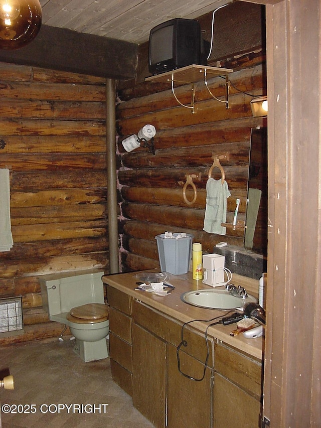 9300 Buddy Werner Dr, Anchorage, AK 99507 - bathroom with rustic walls, toilet, wood ceiling, and vanity