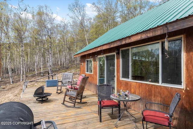 1080 Leuthold Dr, Fairbanks, AK 99712 - wooden deck featuring a fire pit