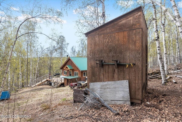 1080 Leuthold Dr, Fairbanks, AK 99712 - view of home's exterior featuring metal roof and a wooden deck