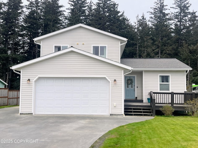517 Sut Larsen Way, Kodiak, AK 99615 - view of front of property with concrete driveway, a deck, a shingled roof, and a garage